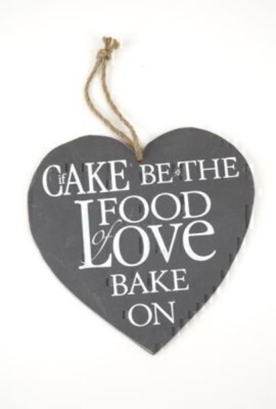 If Cake Be The Food of Love Slate Heart by Heaven Sends. Heart shaped slate with the caption 'If cake be the food of love bake on. Rope hanger. Size 21x22cm.